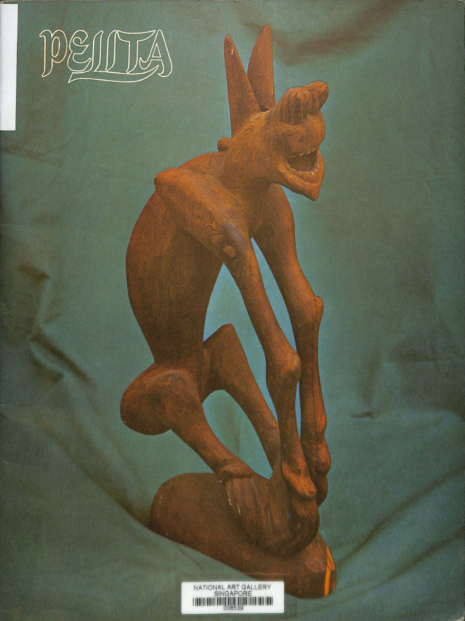 Pelita magazine article ; Orang asli sculpture by Eva Lee