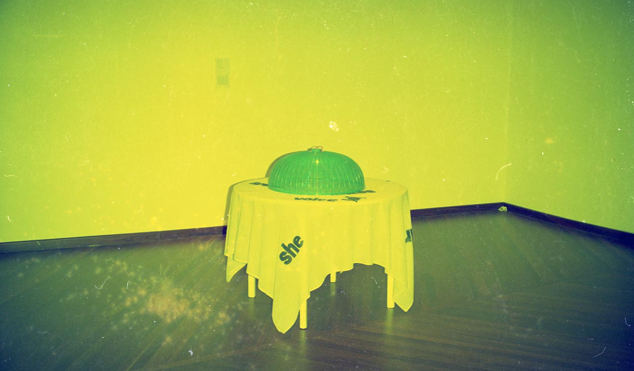 Photographic documentation of "She and her Dishcover" by Amanda Heng at the Singapore Art Museum in 2000