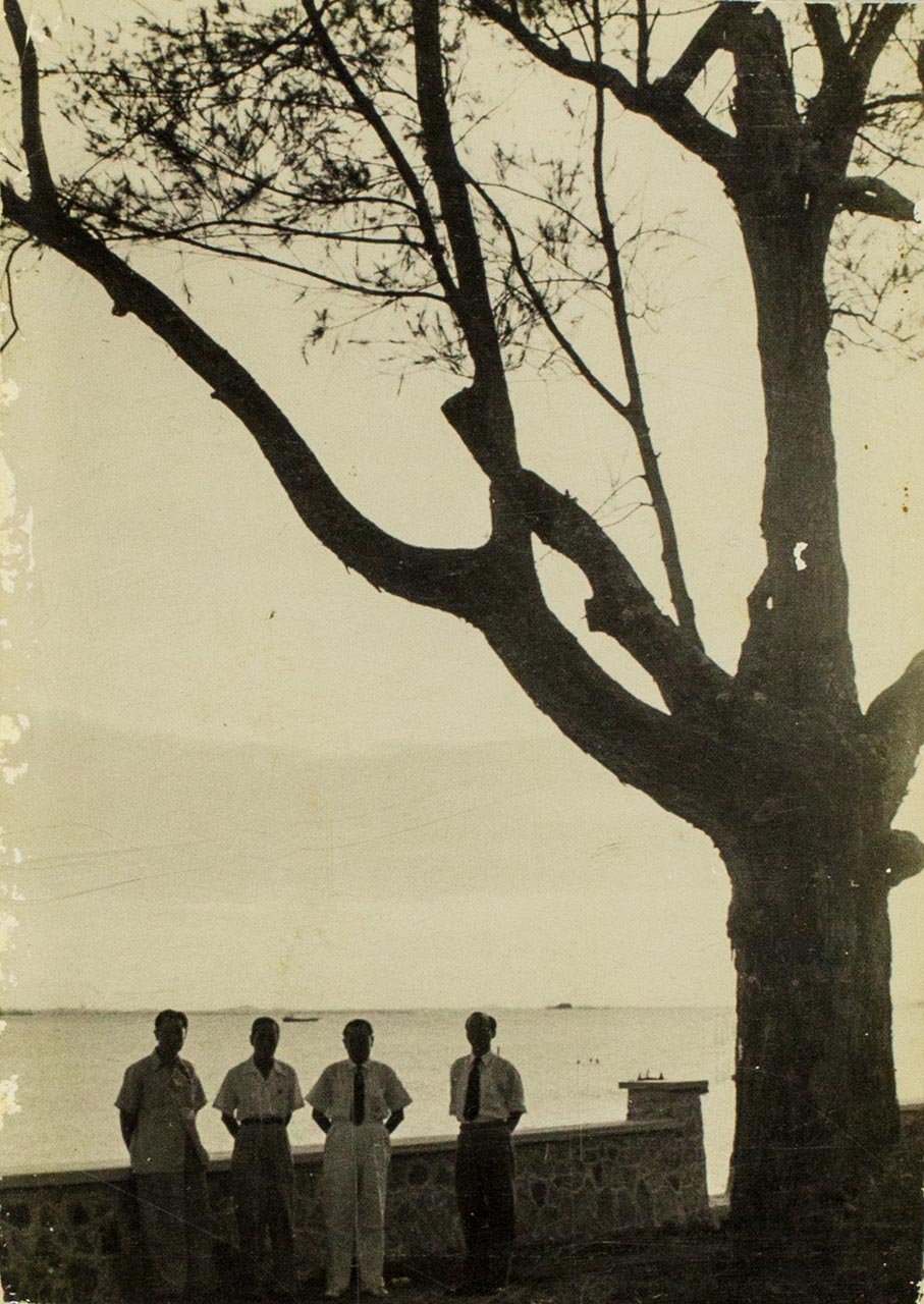 Four men backlit at seaside - Chen Chong Swee's travel photo