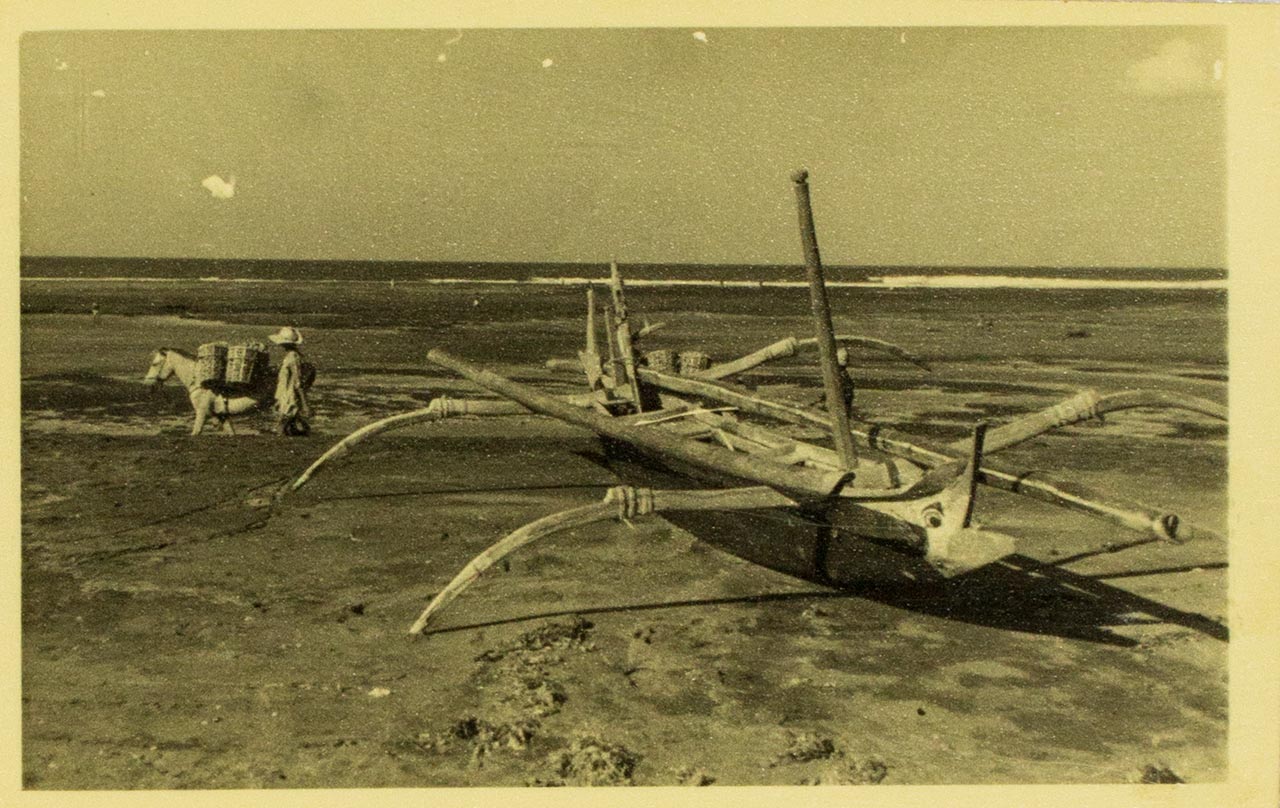 Outrigger boat on beach in Bali