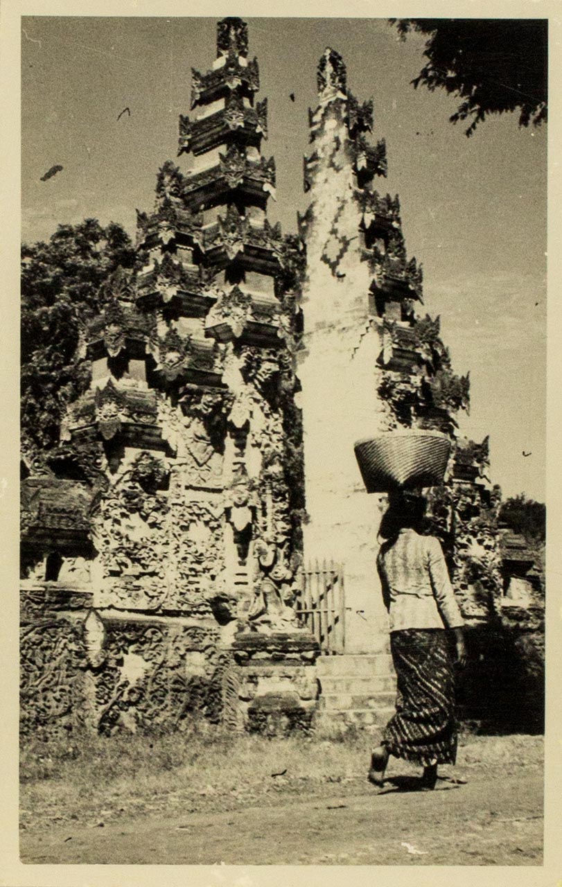 Balinese woman and temple