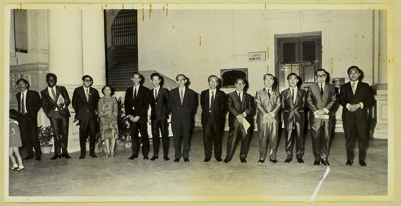 Artists, including Chen Chong Swee, in suits at the Victoria Memorial Hall, Singapore Art Society's exhibition opening 1972