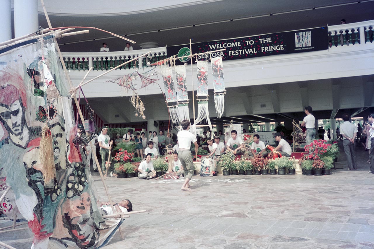 Photographic documentation of the group performance by the Art Commandos at the Sentosa Ferry Terminal