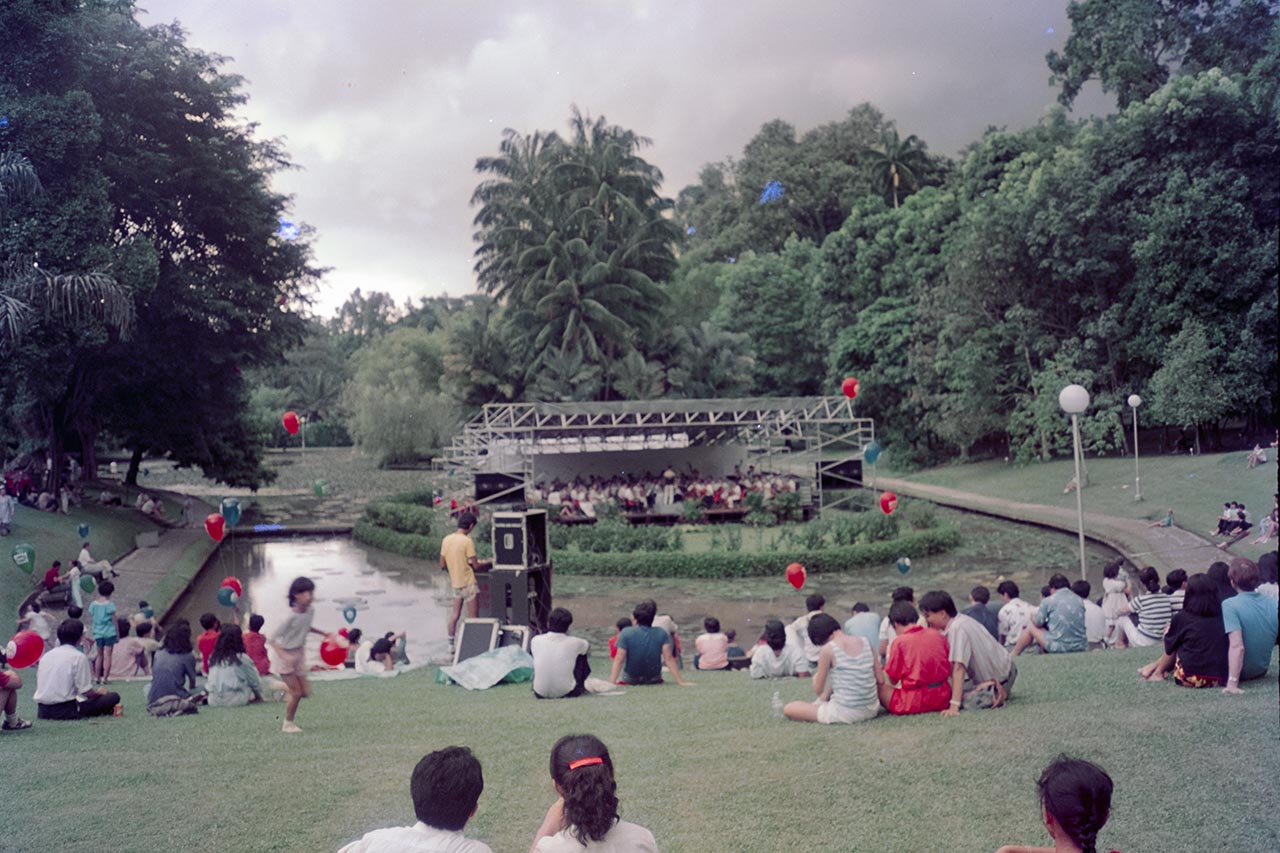 Photographic documentation of an orchestral performance at the Singapore Botanic Gardens