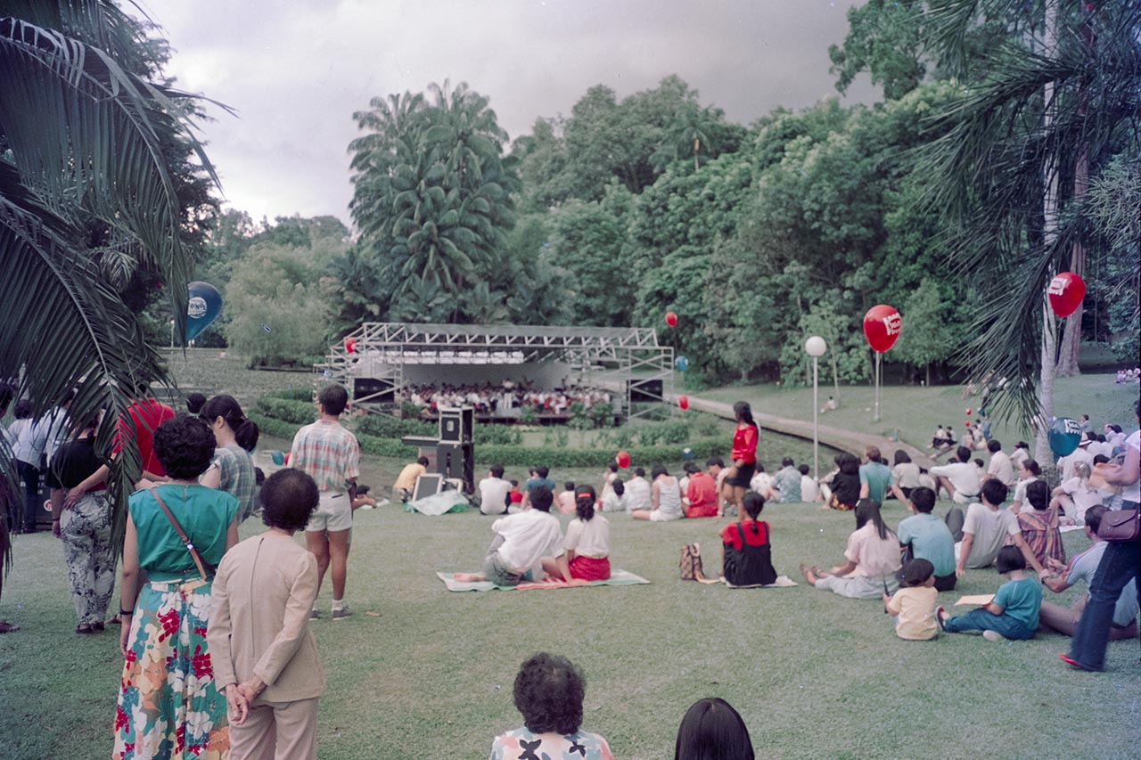 Photographic documentation of an orchestral performance at the Singapore Botanic Gardens