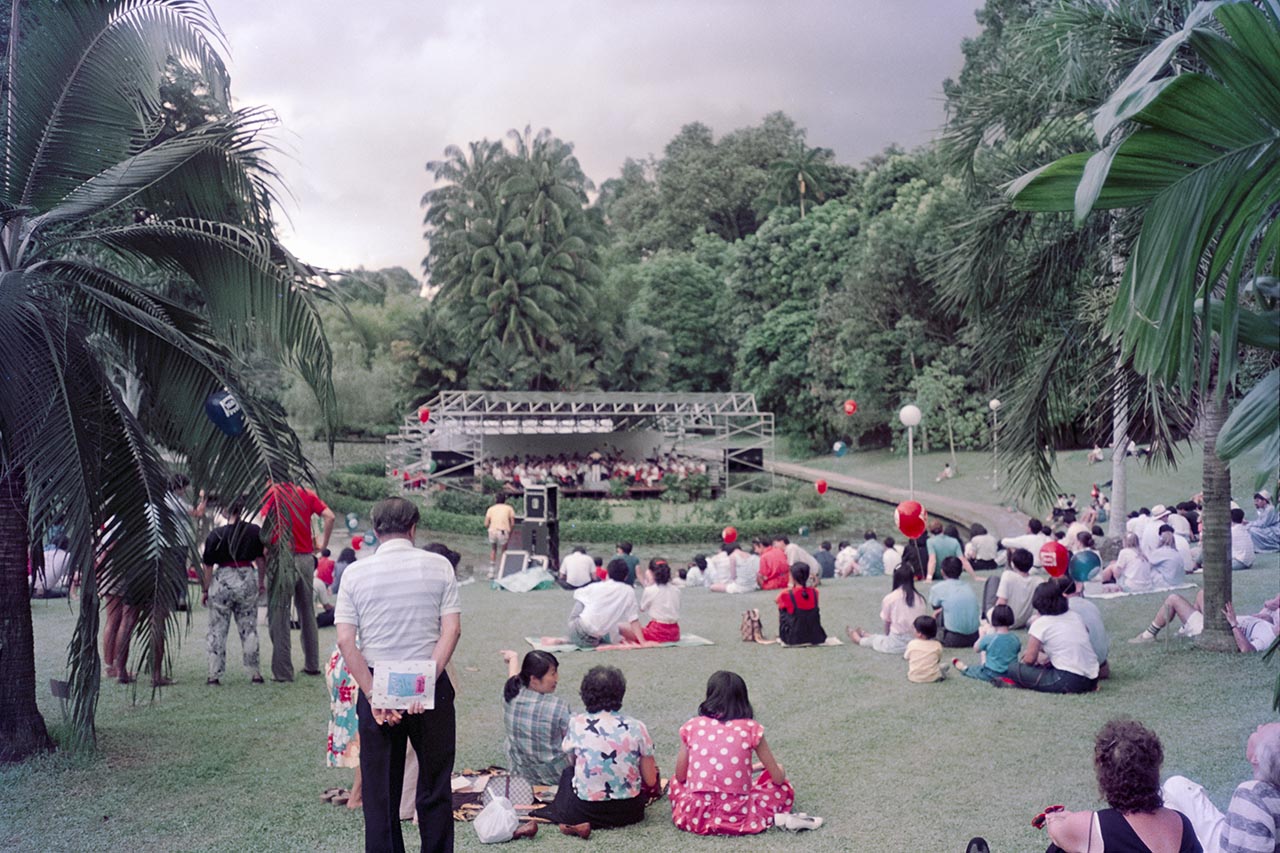 Photographic documentation of an orchestral performance at the Singapore Botanic Gardens