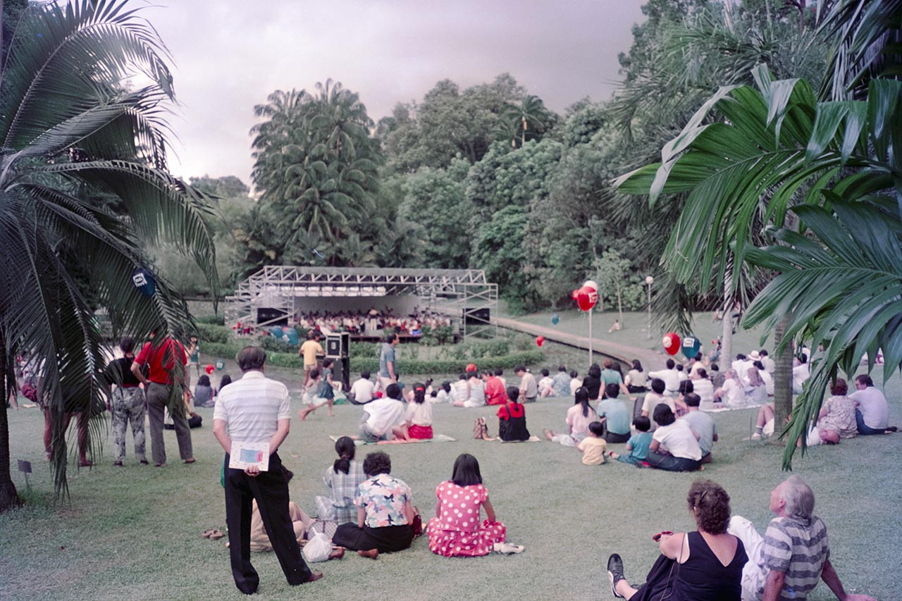 Photographic documentation of an orchestral performance at the Singapore Botanic Gardens