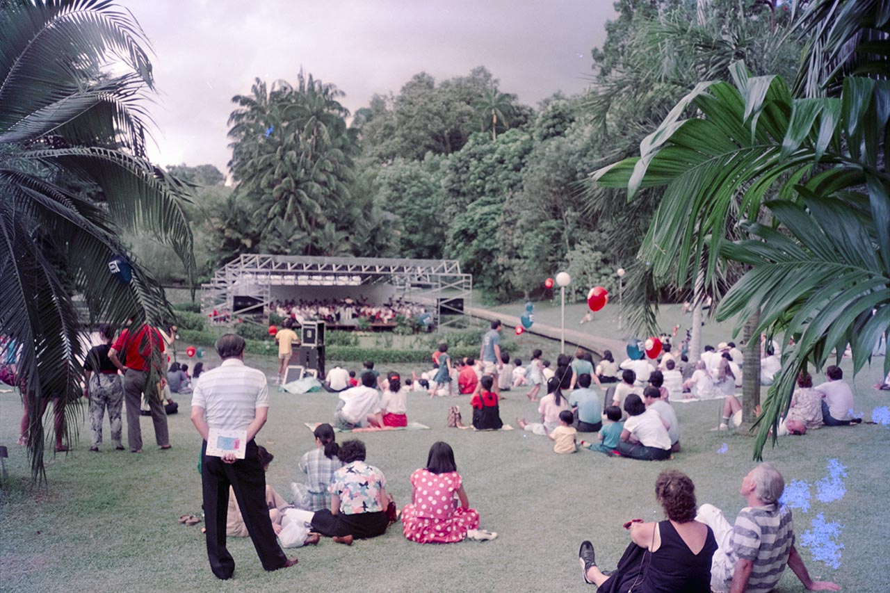 Photographic documentation of an orchestral performance at the Singapore Botanic Gardens