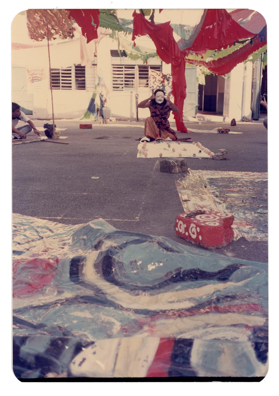 Photographic documentation of Lut Ali's performance at the Former St Joseph's Institution
