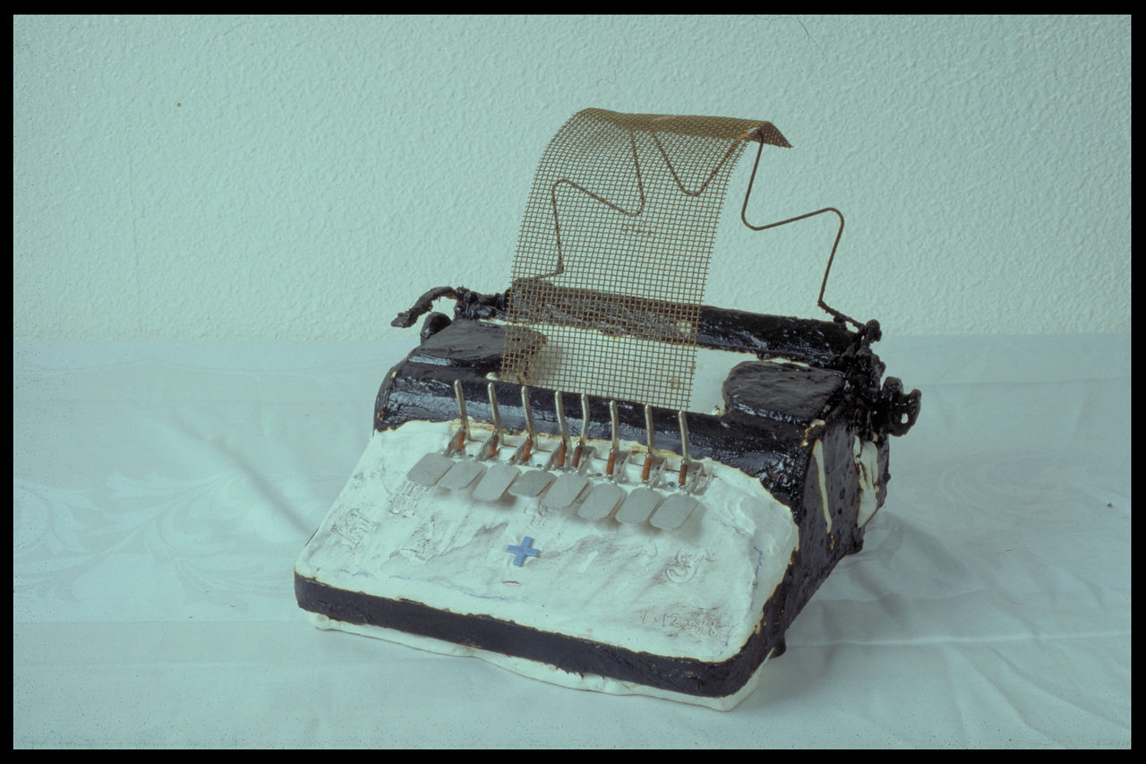 War Sculpture #3: Typewriter with Blue Cross