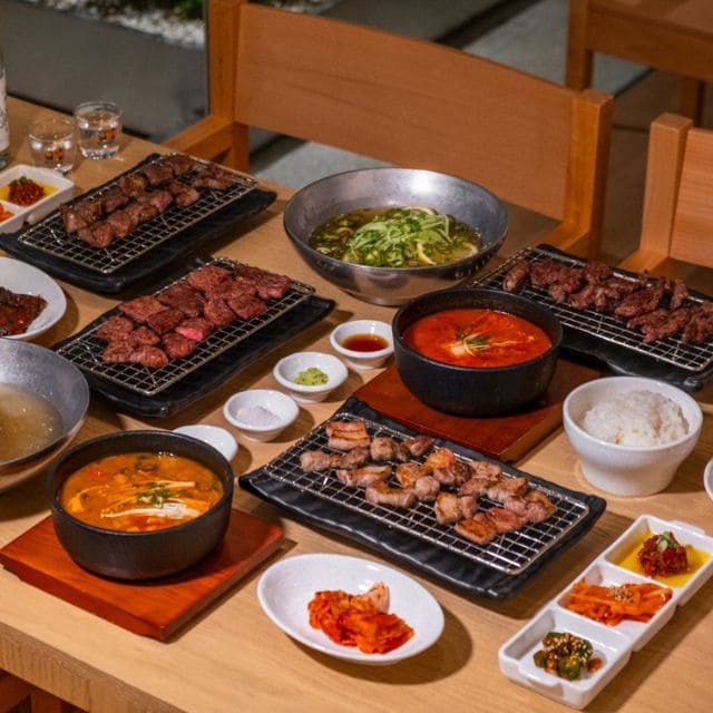 Close-up of a vibrant fire in a pan, fueled by wood, showcasing the essence of Korean BBQ cooking.