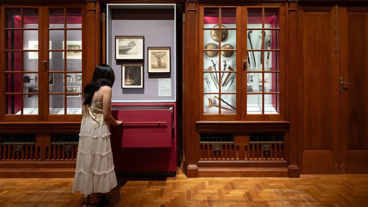 Visitor looking at artefacts of Singapore's judicial history