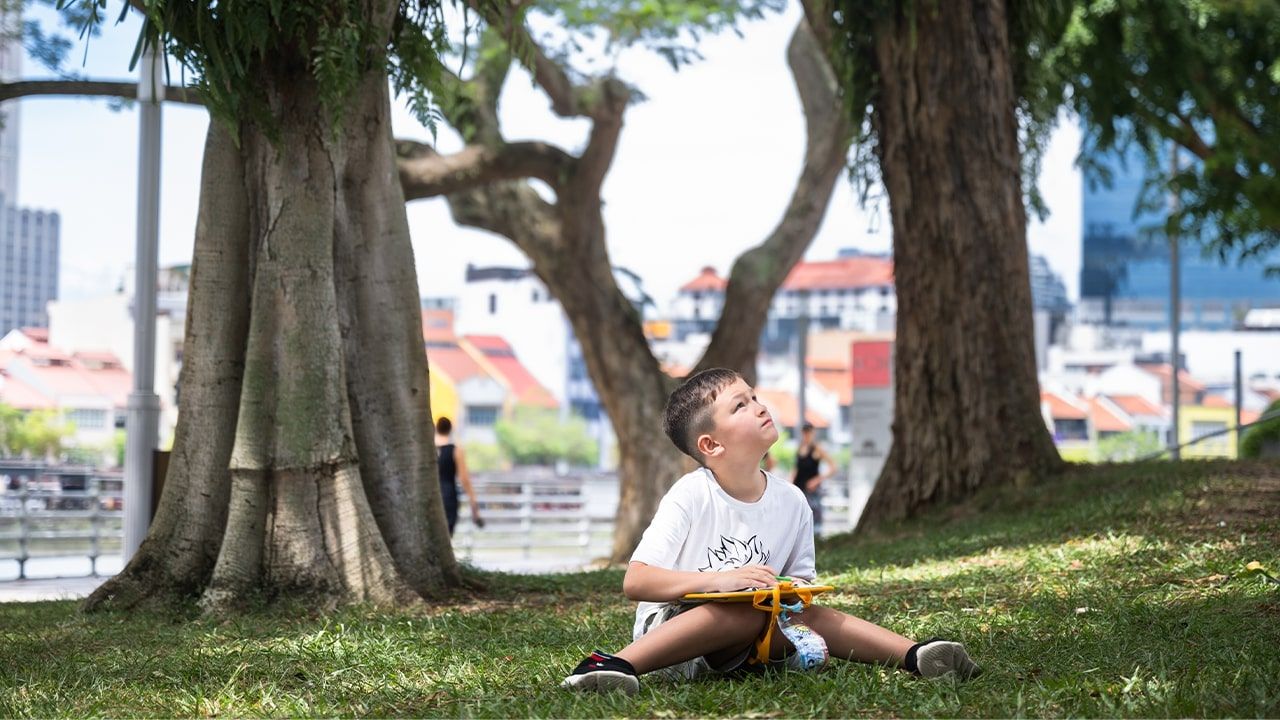Participant of the Artventure Camp doing their outdoor sketching along the Singapore River