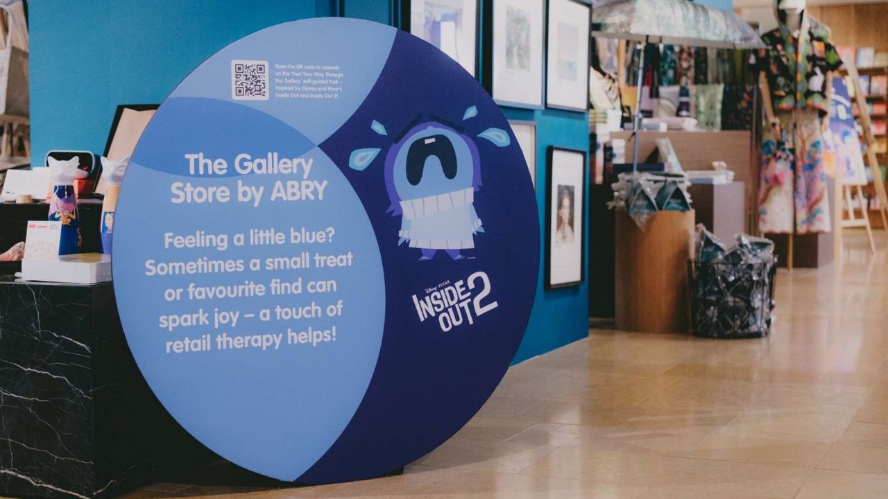 Inside Out trail marker featuring an emotion character tied to the stop