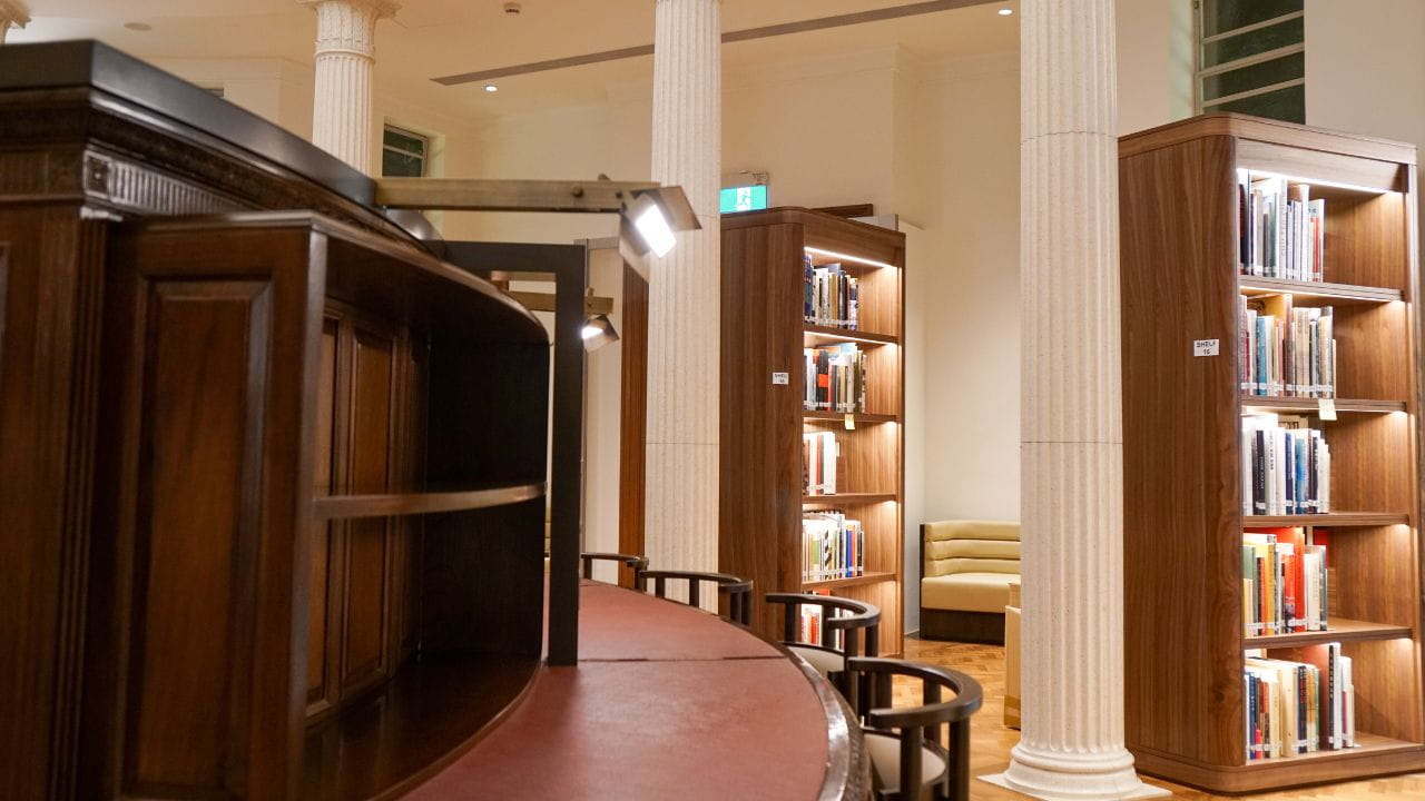 Reference section of the Rotunda Library, with tables and furniture arranged in circular-formation around the library structure.