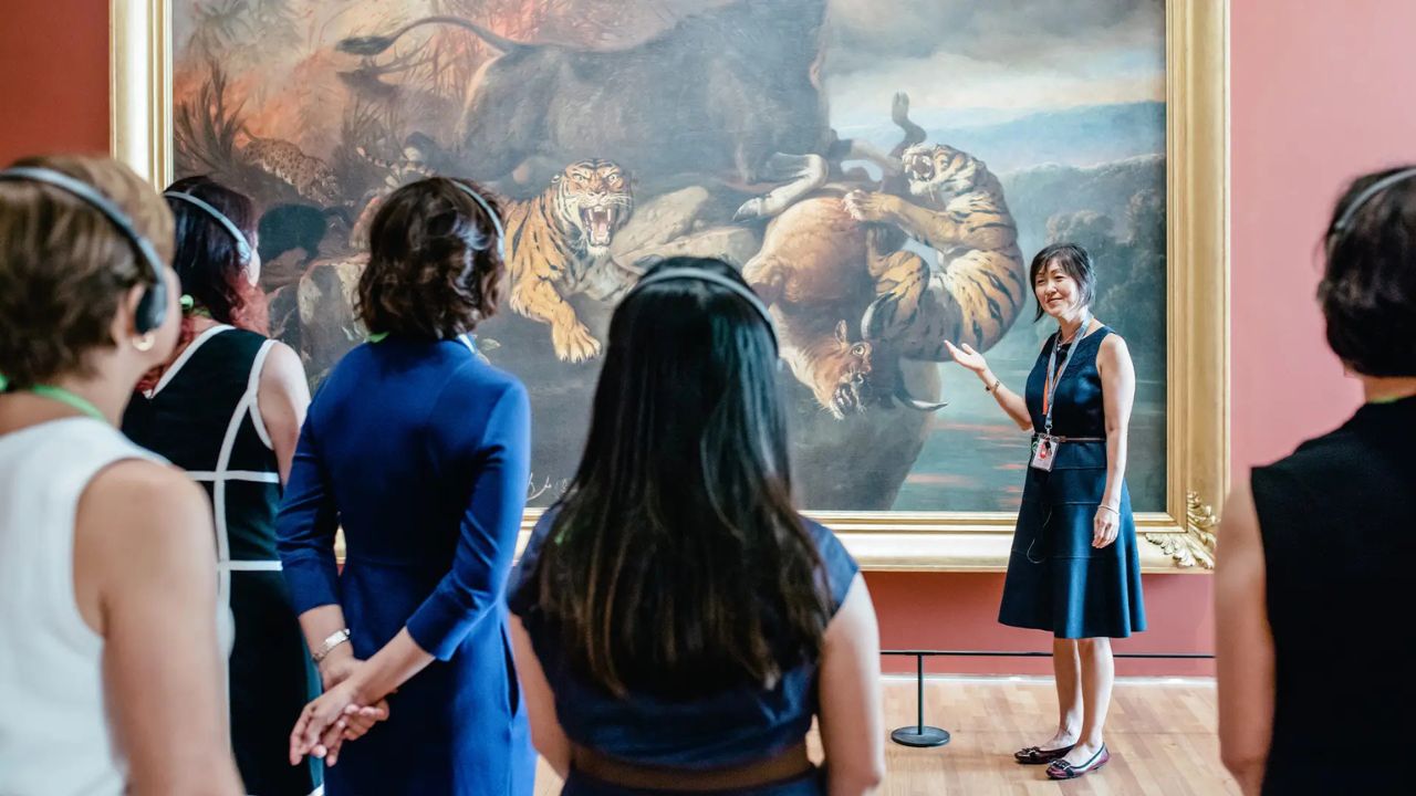 Gallery visitors on a guided tour of an exhibition, facilitated by a Gallery docent.