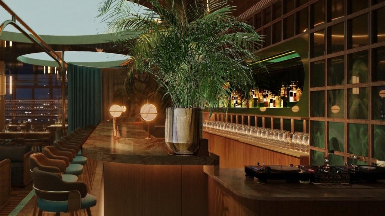 Xava Skybar at National Gallery Singapore features a sophisticated bar and dining area in a restaurant, featuring earthly tones.