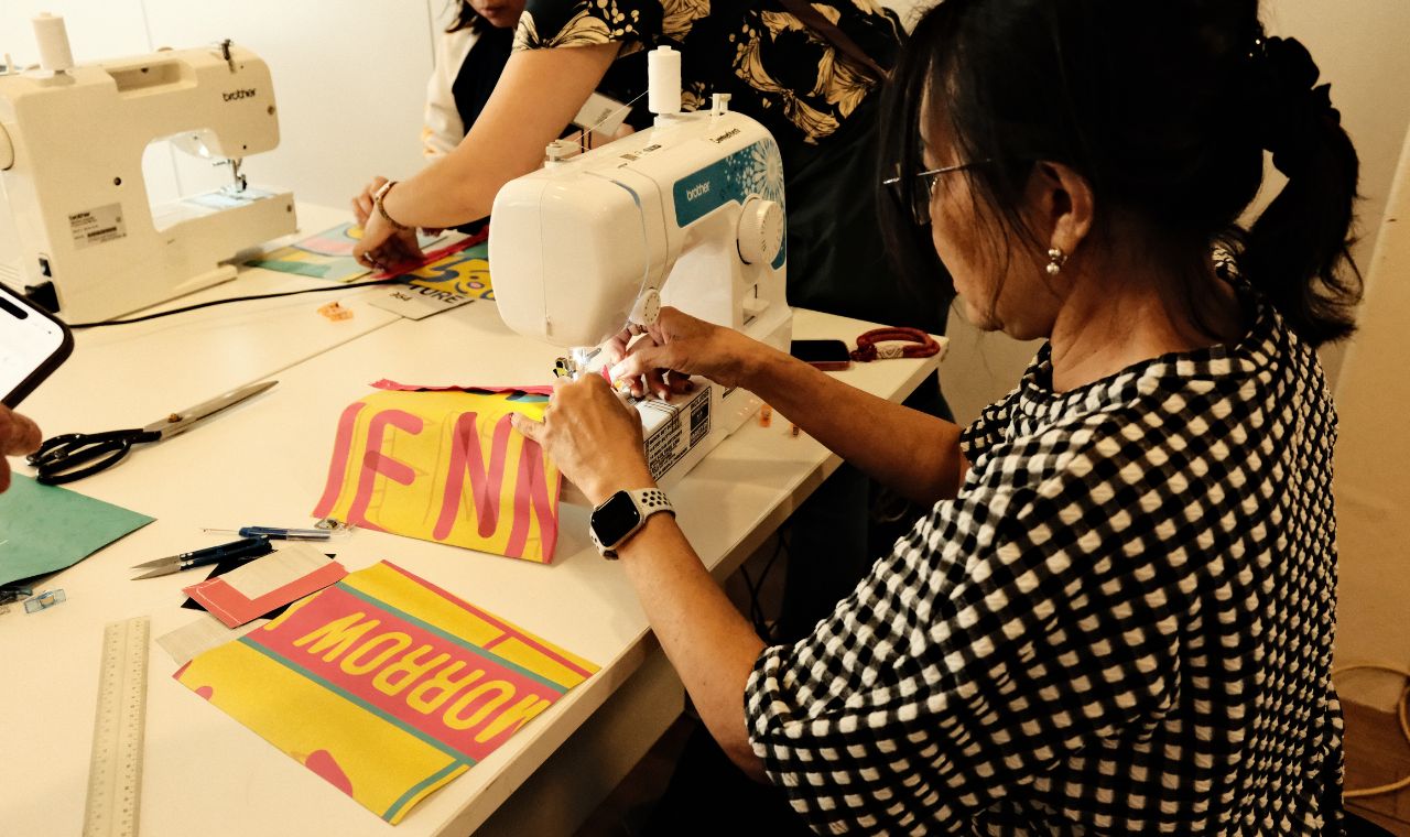 Gallery Insider upcycling recycled banners into a pouch