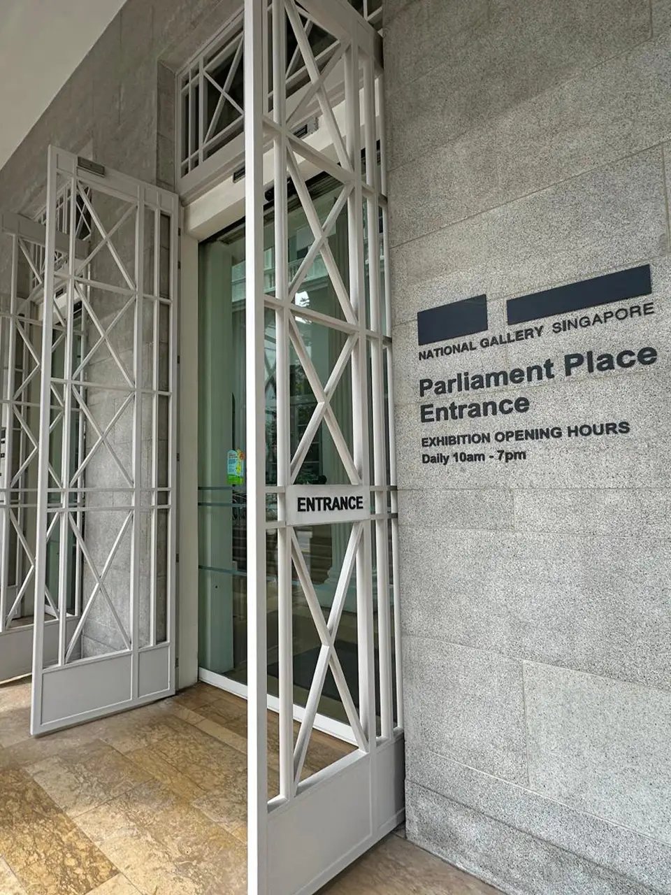 Side view of the Parliament Place Entrance of the National Gallery Singapore with the doors opened