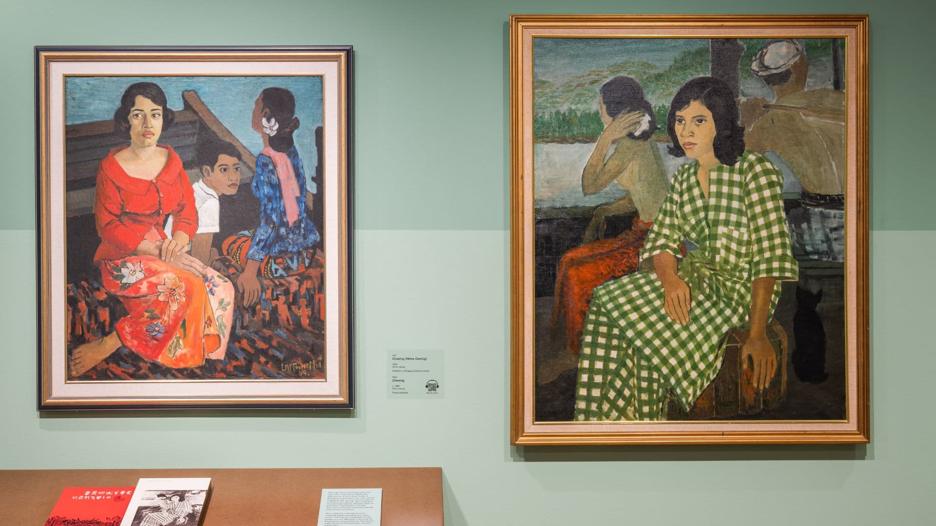 Two paintings of women displayed in a museum, showcasing artistic styles and expressions.