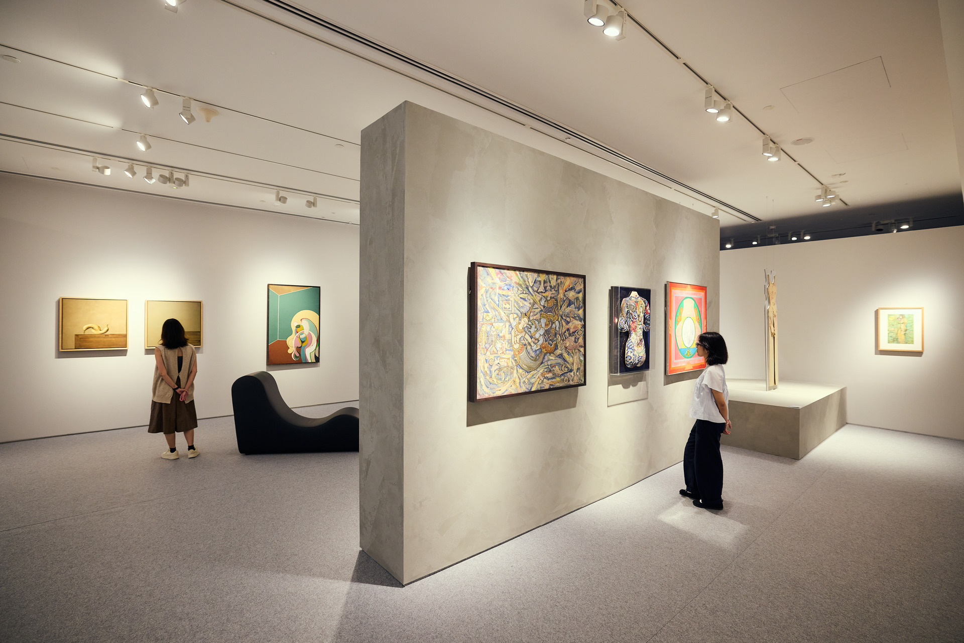 Gallery installation view of Passion is Volcanic, with visitors admiring the artworks on display