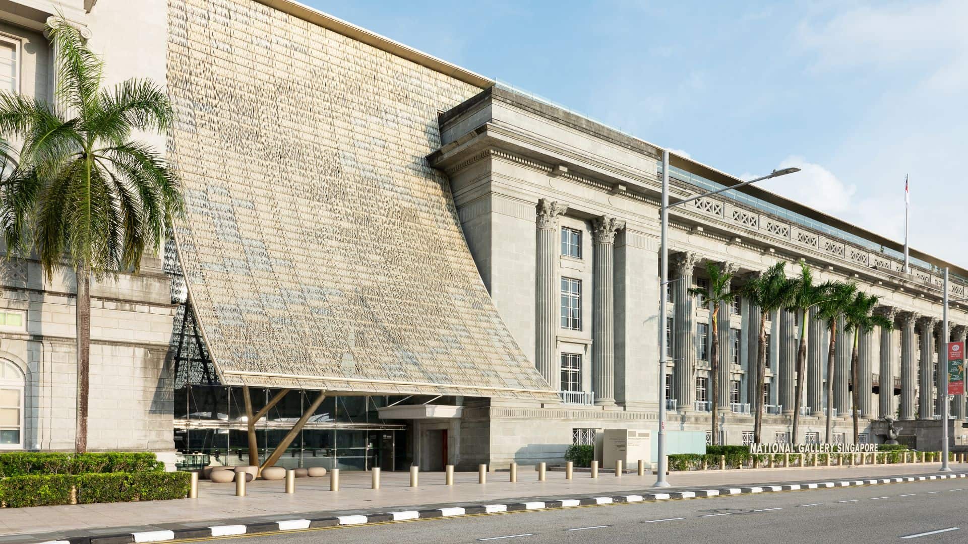 Exhibition banner for Building Highlights- exterior view of the National Gallery Singapore’s historic building with grand white columns and patterned marble steps, featured in the Building Highlights guided tour.
