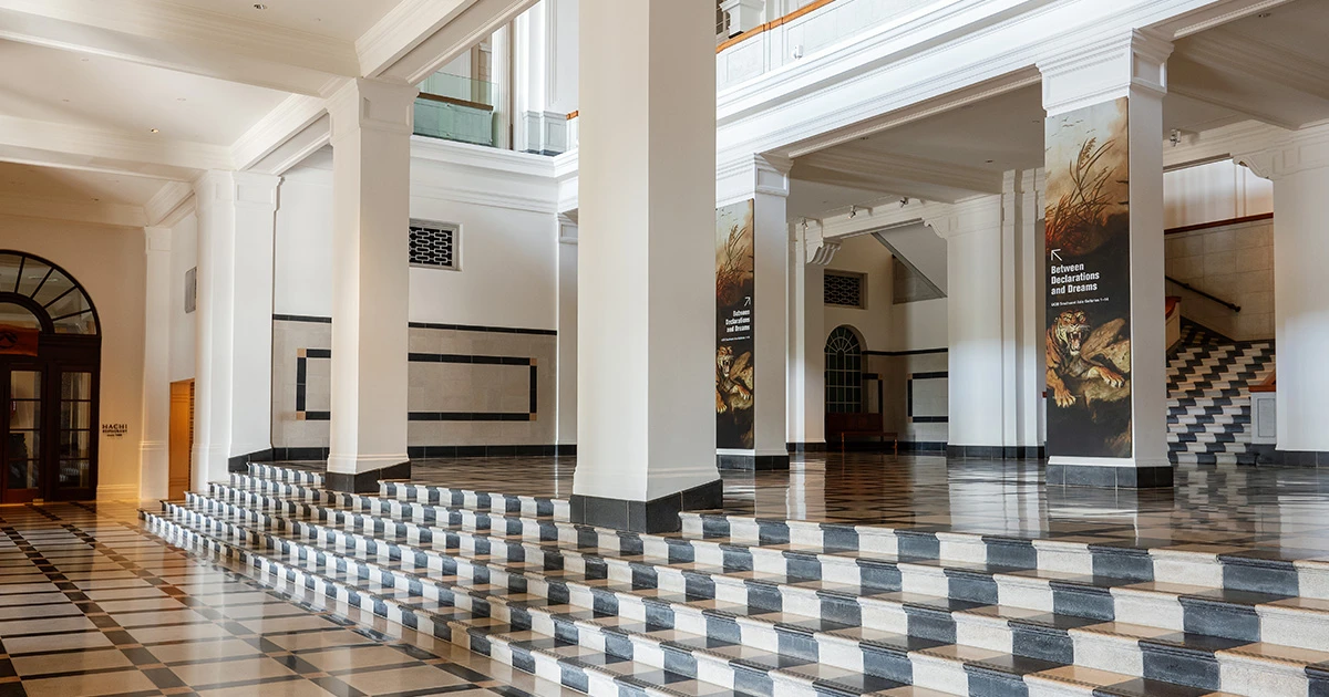 Interior of National Gallery Singapore, featuring contemporary Art Deco interior details, notably a bold black-and-white terrazzo flooring